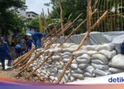 Anwohner sagen, dass die Überschwemmungen in Petogogan durch den Dammbruch schwerwiegend geworden seien